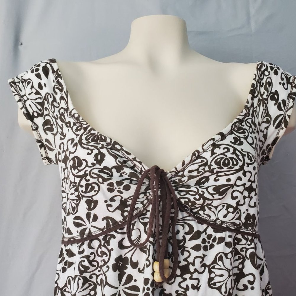 Brown and white floral sleeveless blouse
